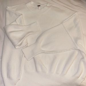 Free People white sweater size Medium.